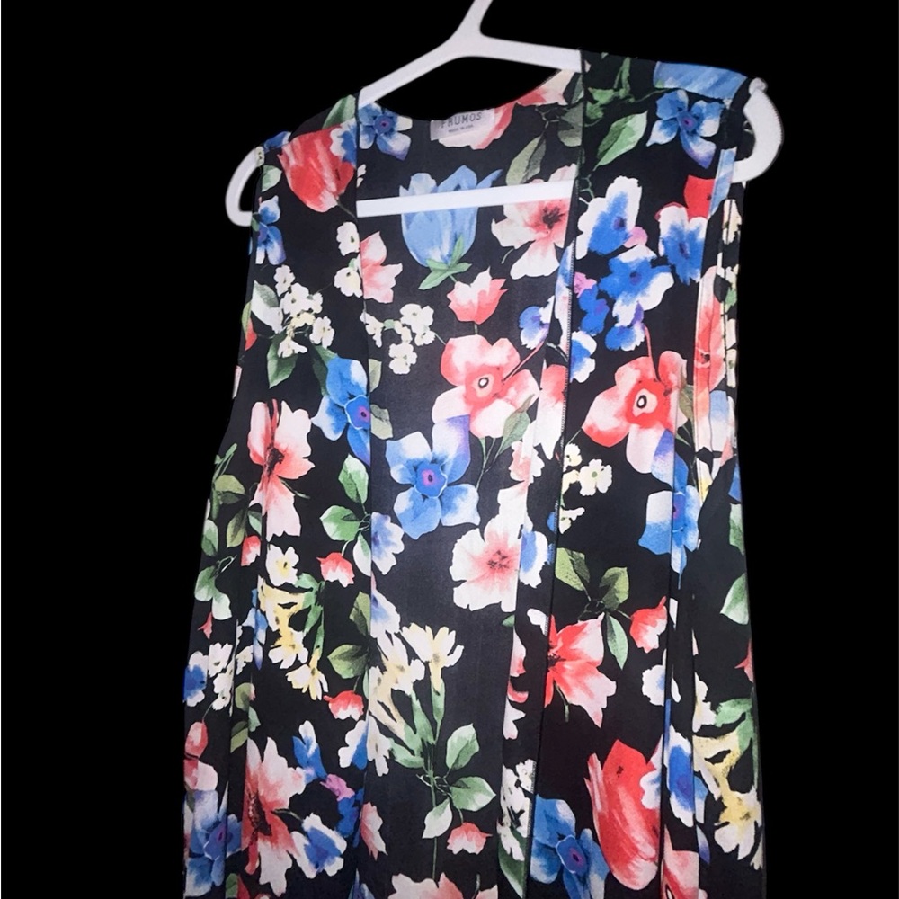 Sleeveless cover-up for spring and summer double side splits. Layering piece.